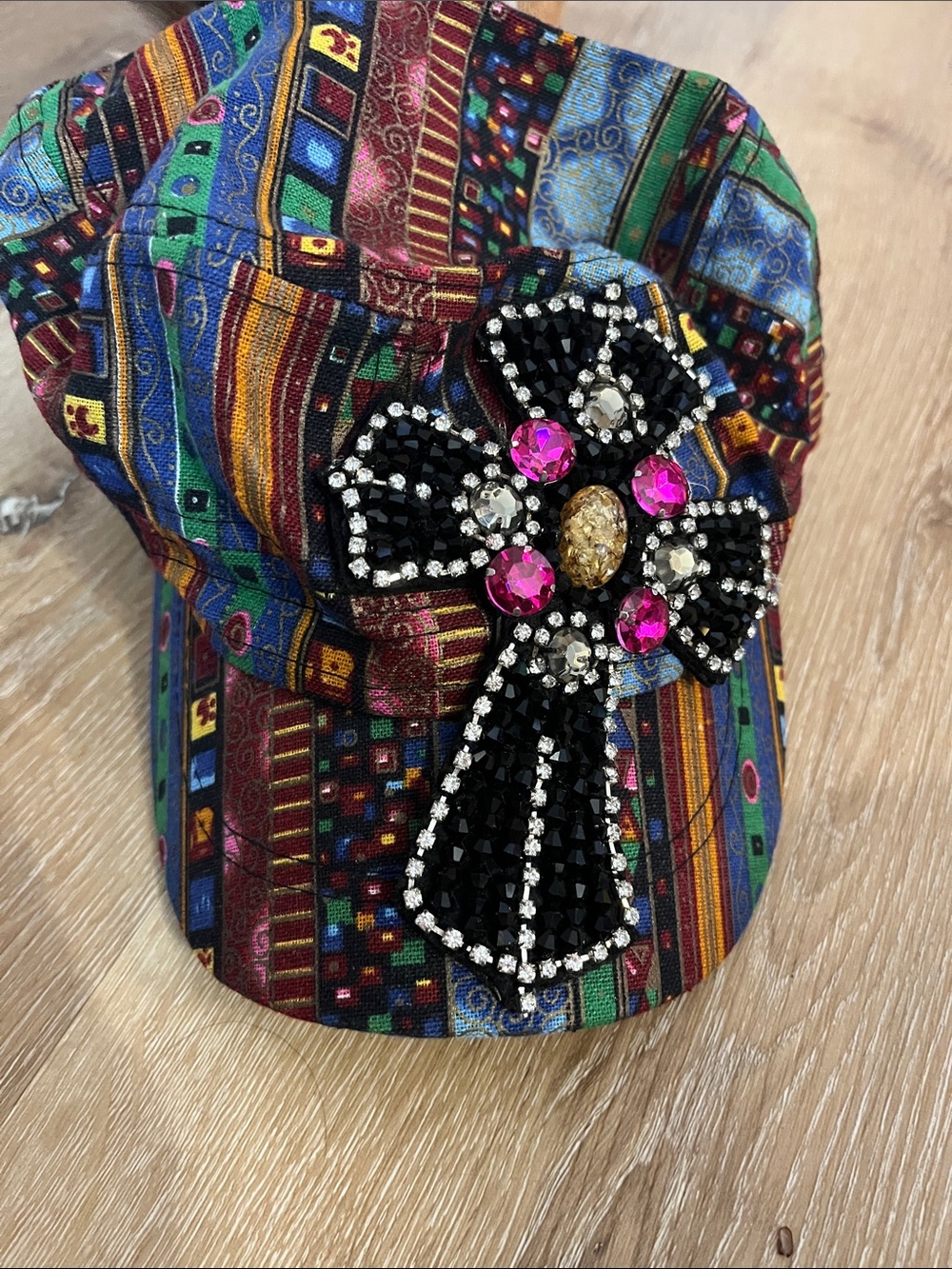 Multicolor Patterned Women's Cap with Black Jeweled Cross Accent